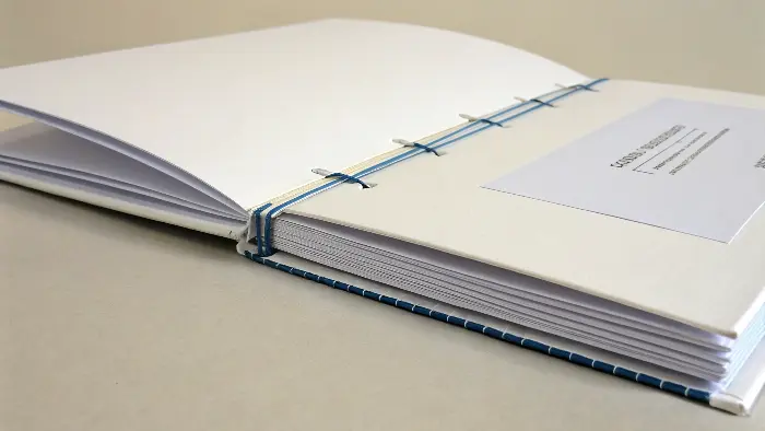A stack of saddle-stitched booklets